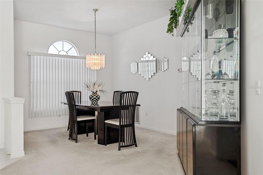 9016 Easthaven Court New Port Richey, FL 34655 - Photo 4 of 38 a view of a dining room with furniture