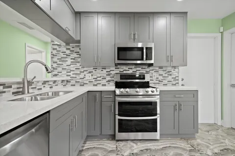 a view of a room with a fan and a window