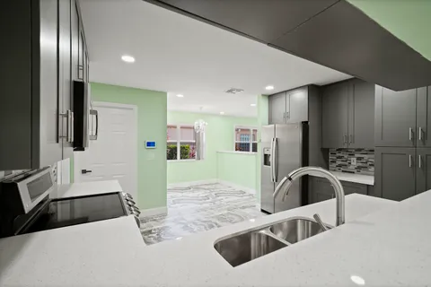 a view of hallway with washer and dryer