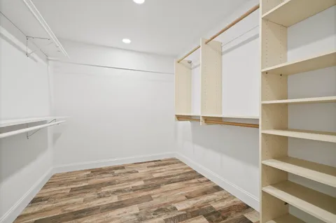 a bathroom with a sink toilet a mirror and shower