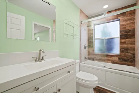 a view of room with window and ceiling fan