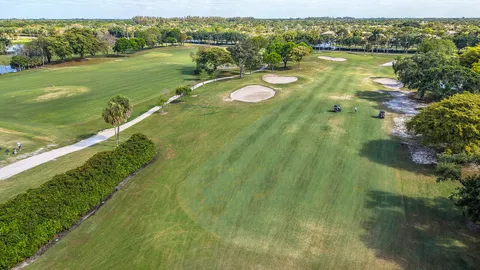 a view of a swimming pool with an outdoor space and seating area