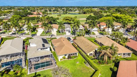 an aerial view of residential houses with yard