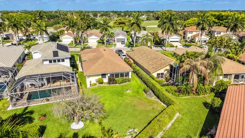 an aerial view of a house with a swimming pool