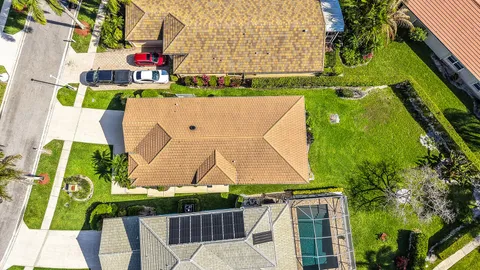 an aerial view of residential houses with outdoor space