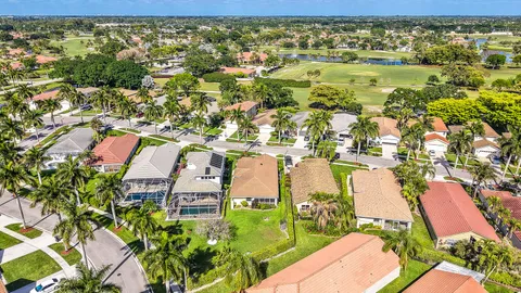an aerial view of house with yard swimming pool and outdoor seating