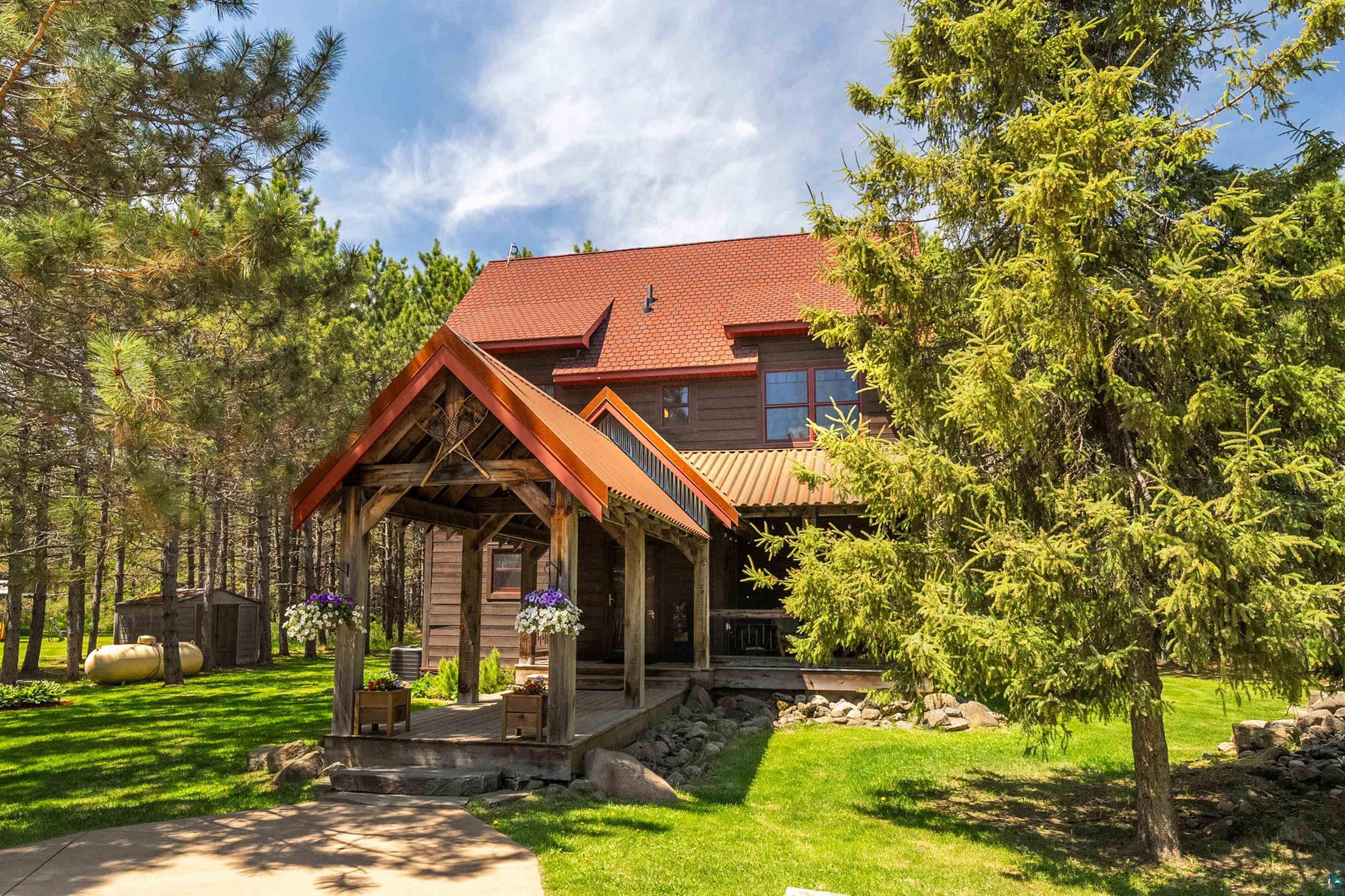 75 East Stark Road Esko, MN 55733 - Photo 51 of 87 Wood-sided property featuring a covered porch entry with exposed timber framing