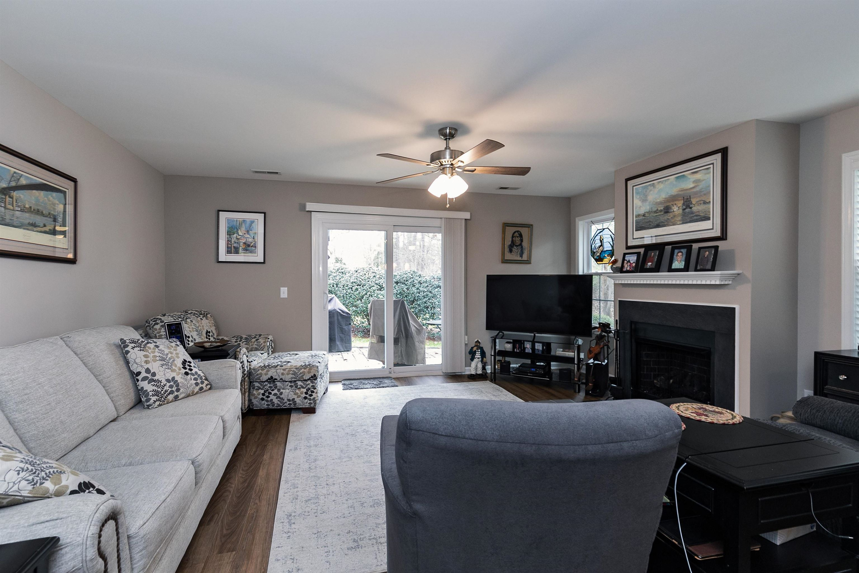 2213 Wellington Ridge Loop Cary, NC 27518 - Photo 3 of 29 Pergo flooring welcomes you to this spacious family room with multiple places for seating... Family Room