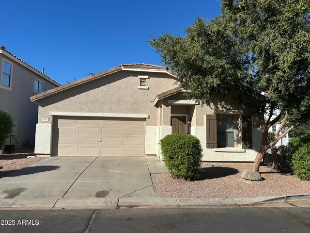 a front view of a house with a garage