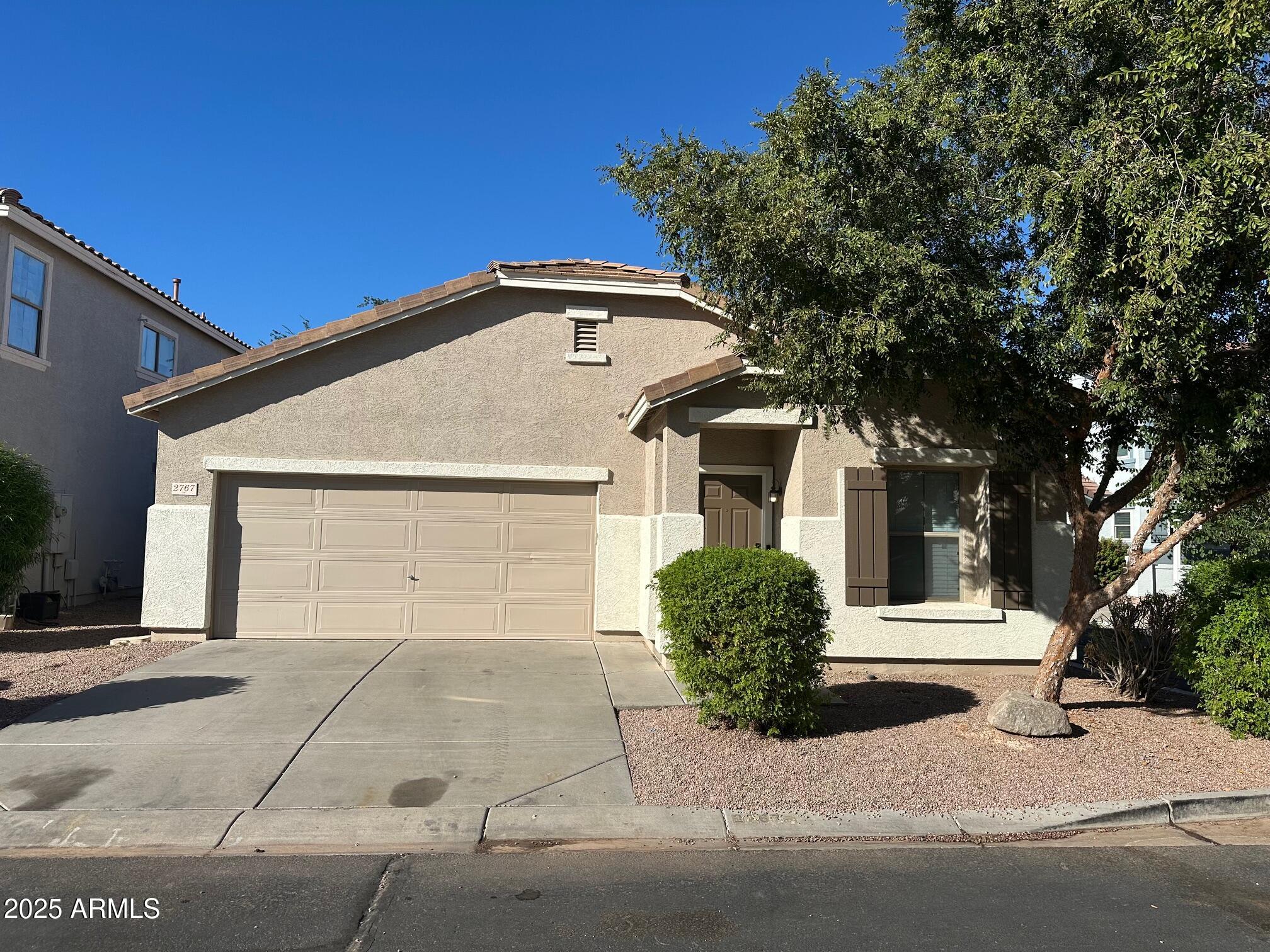 2767 South Sailors Way Gilbert, AZ 85295 - Photo 1 of 15 a front view of a house with a garage