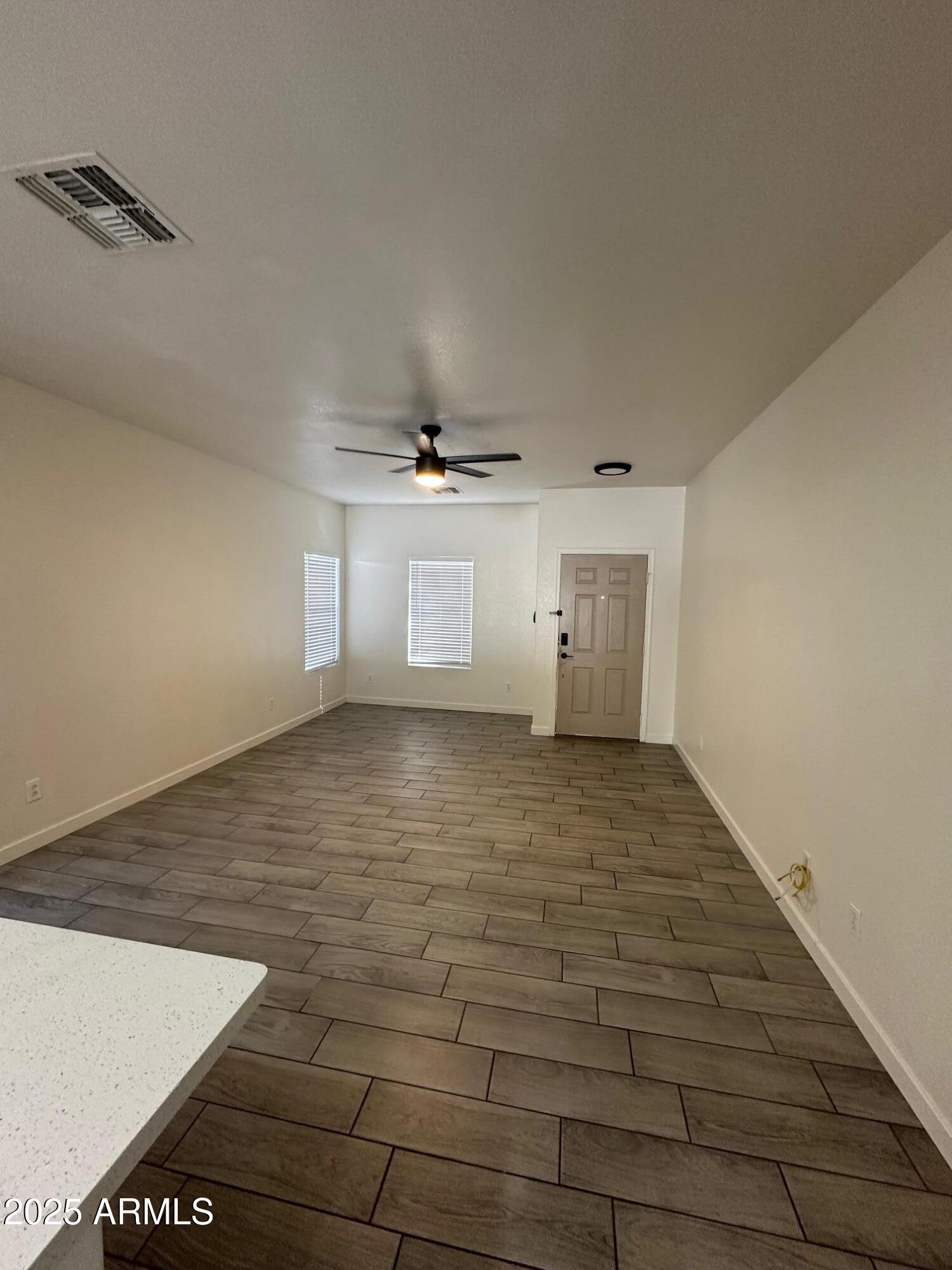 2767 South Sailors Way Gilbert, AZ 85295 - Photo 15 of 15 a view of empty room with wooden floor and fan