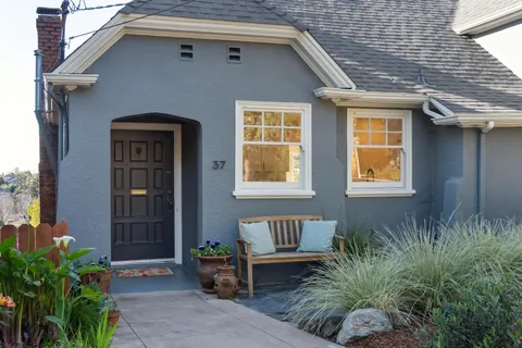 a front view of a house with garden