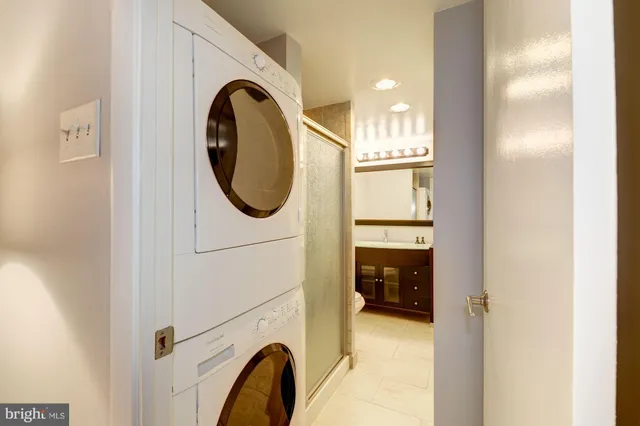 a bathroom with a sink and a washer