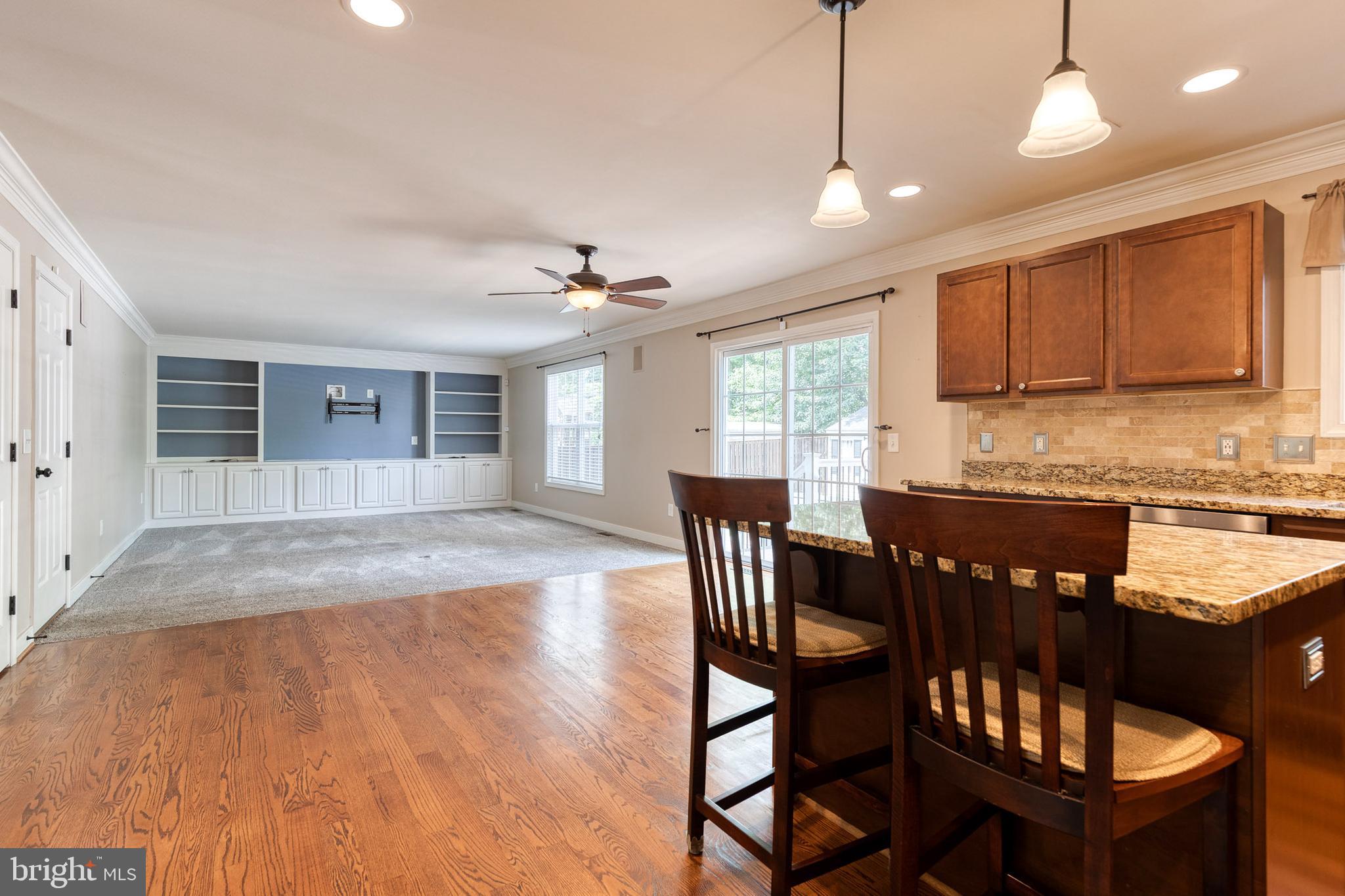 768 Stevenson Road Severn, MD 21144 - Photo 14 of 41 a view of a dining room with furniture and wooden floor