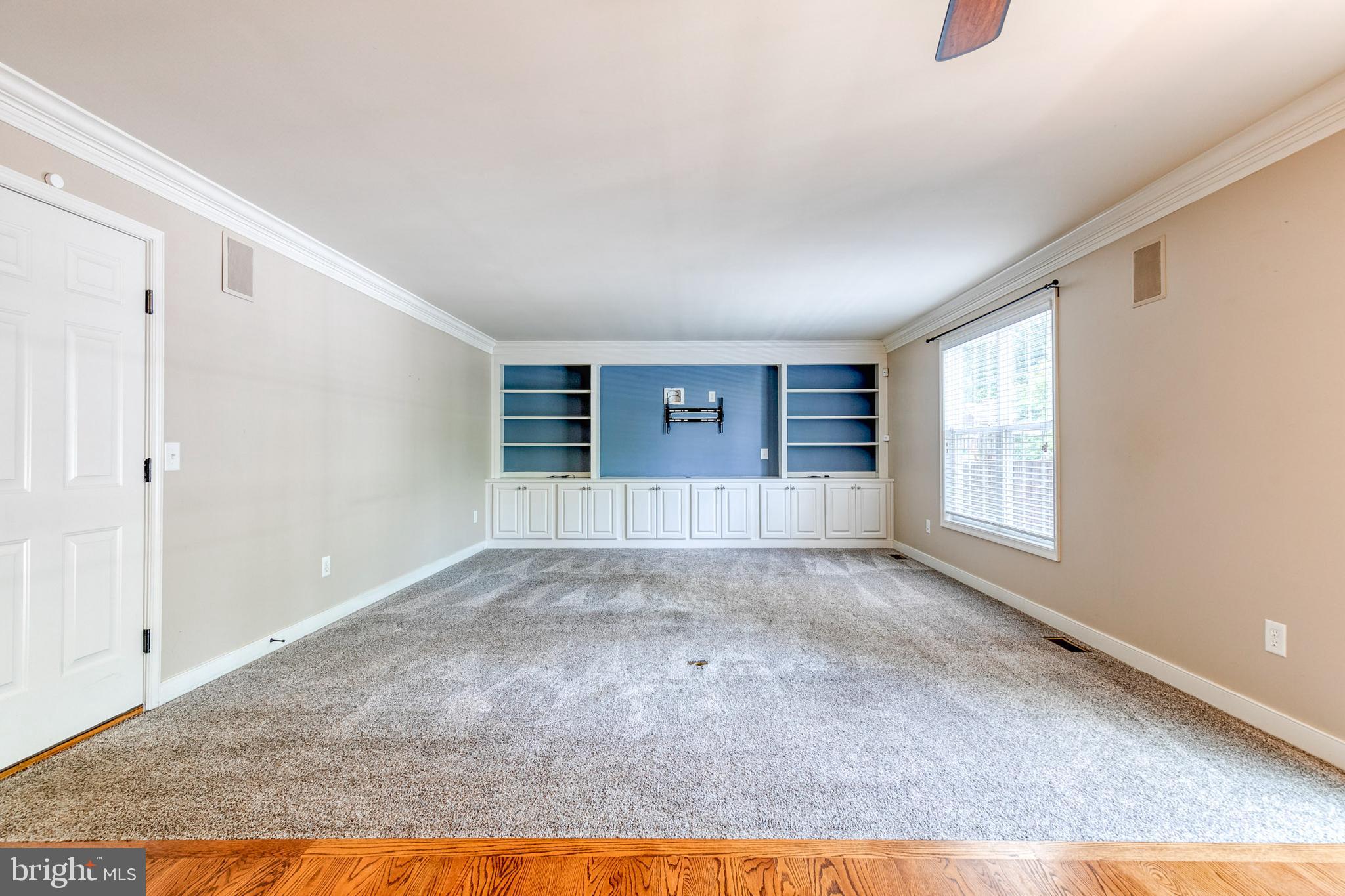 768 Stevenson Road Severn, MD 21144 - Photo 16 of 41 a view of empty room with wooden floor and fan