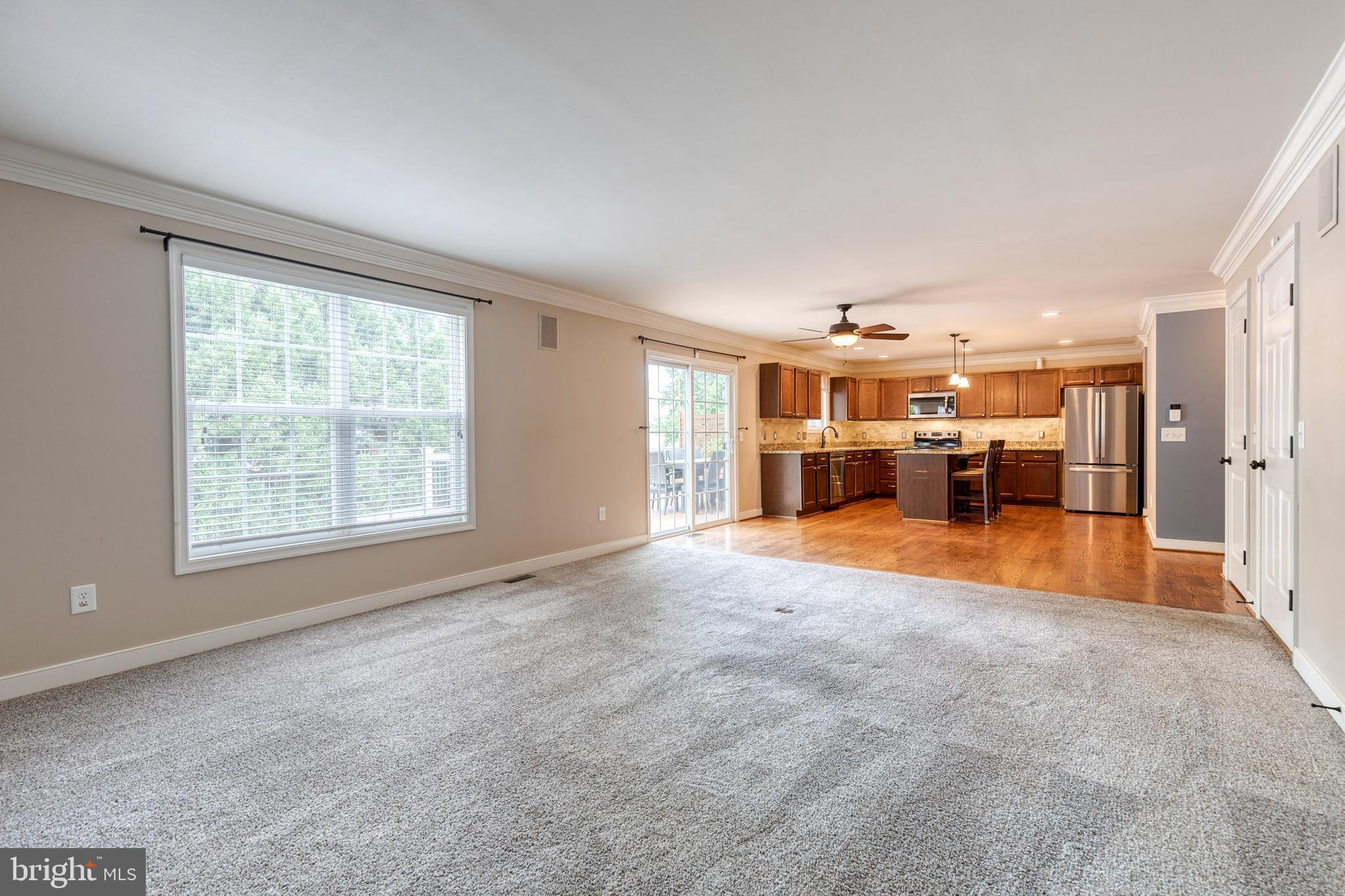 768 Stevenson Road Severn, MD 21144 - Photo 18 of 41 a view of empty room with furniture and large window