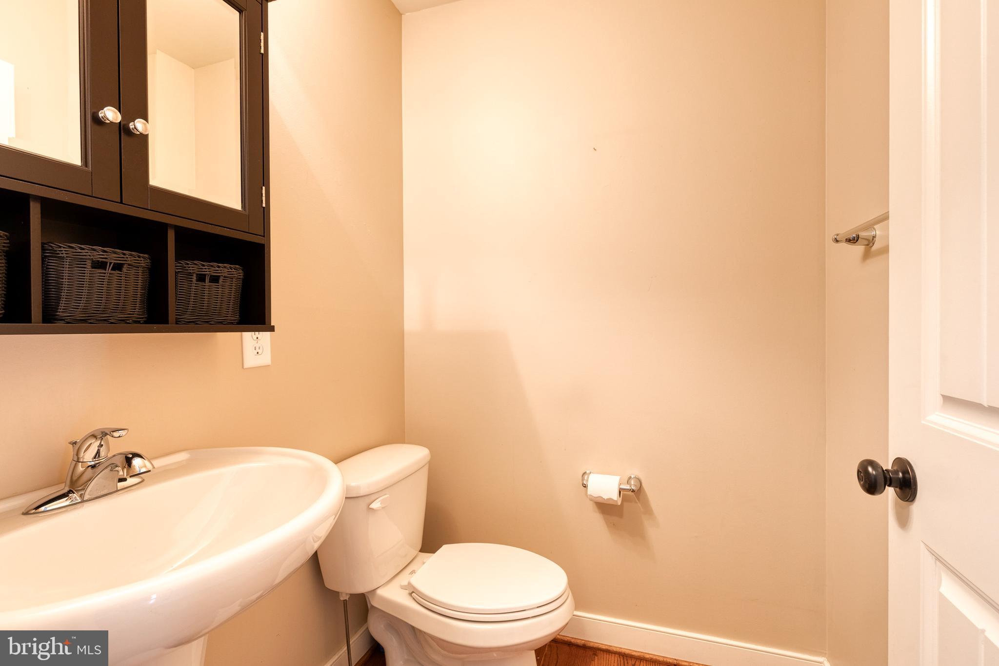 768 Stevenson Road Severn, MD 21144 - Photo 19 of 41 a bathroom with a sink and a toilet