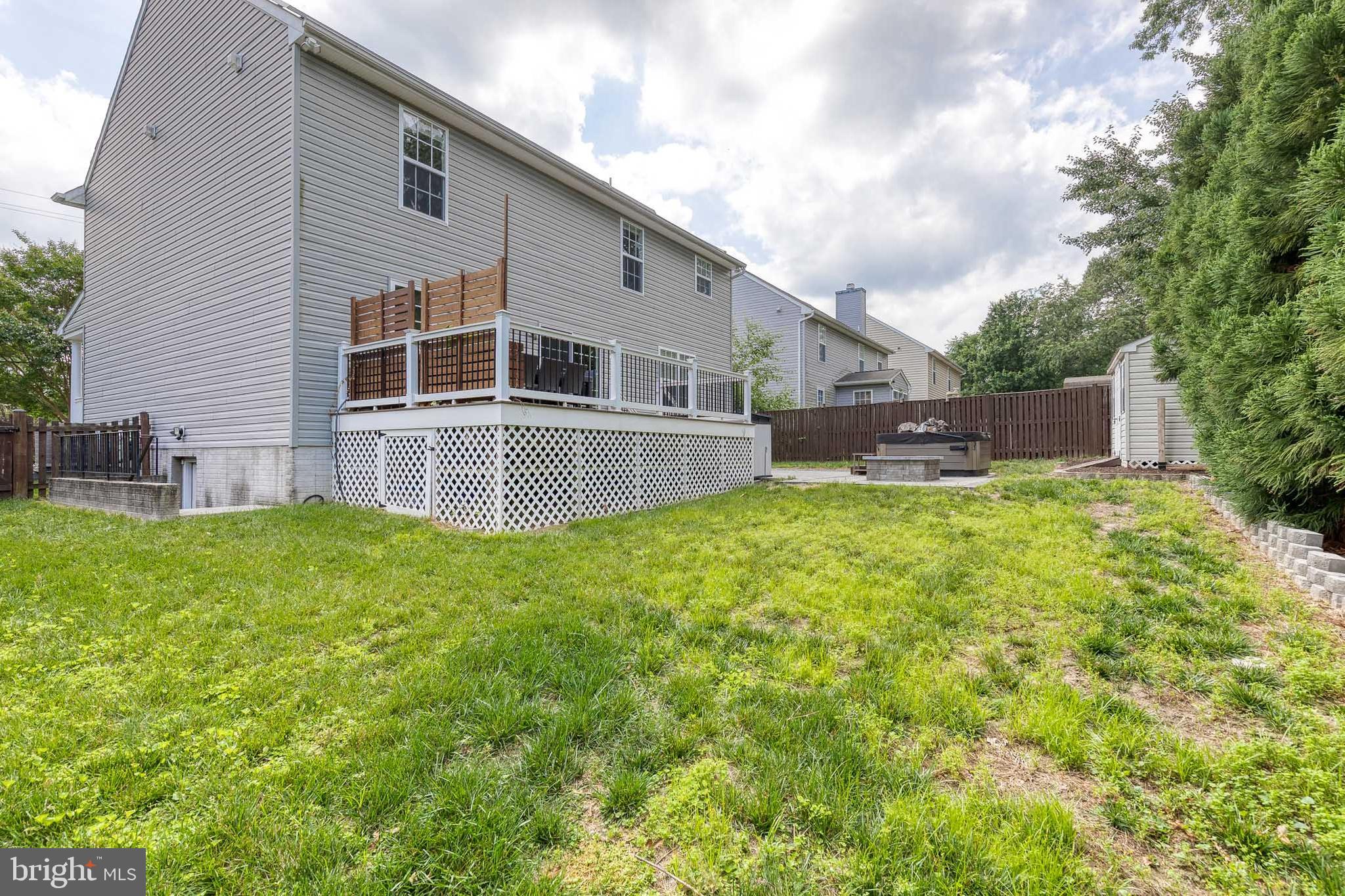 768 Stevenson Road Severn, MD 21144 - Photo 40 of 41 a backyard of a house with table and chairs