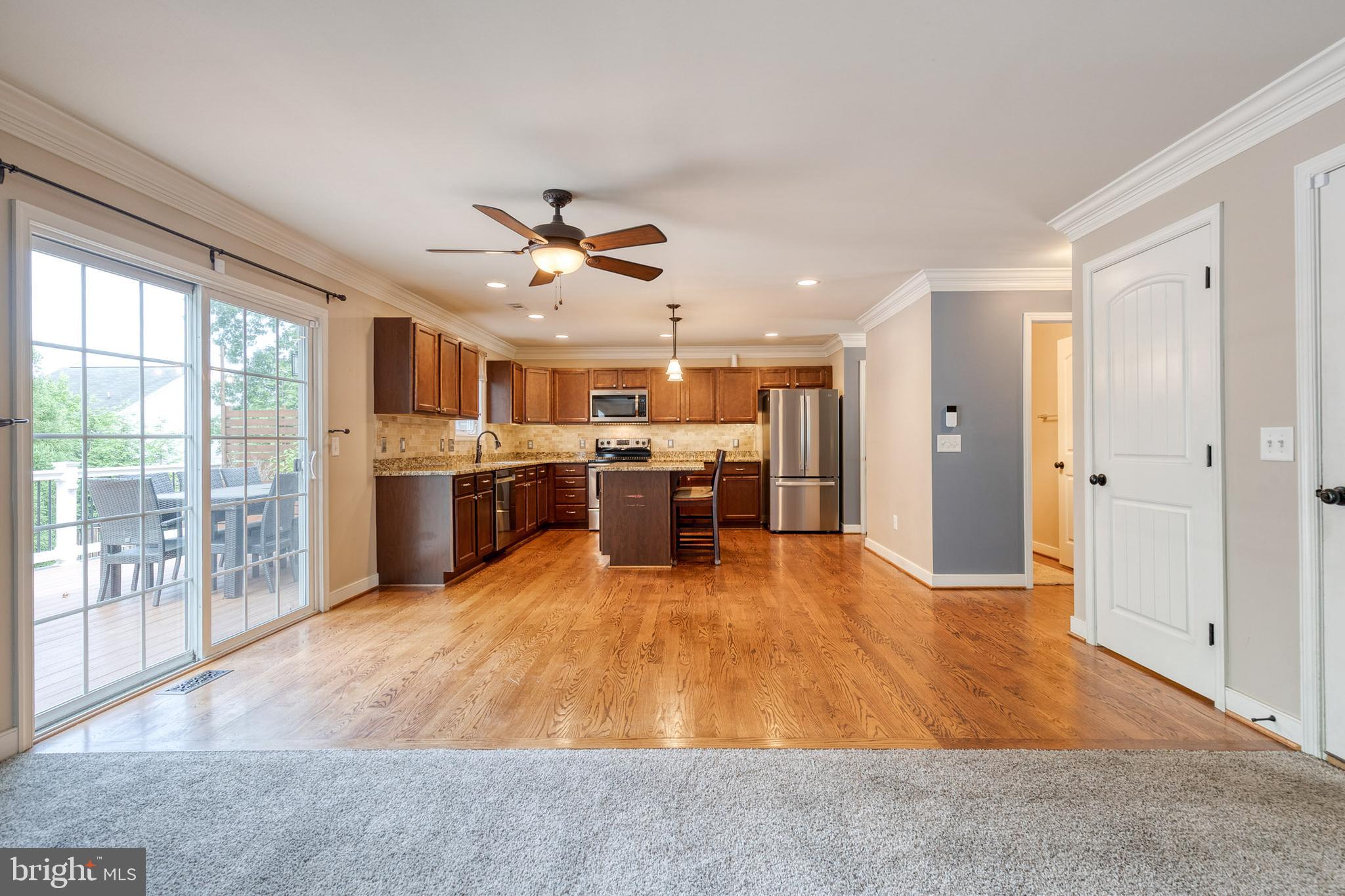 768 Stevenson Road Severn, MD 21144 - Photo 9 of 41 a big room with chandelier fan and windows