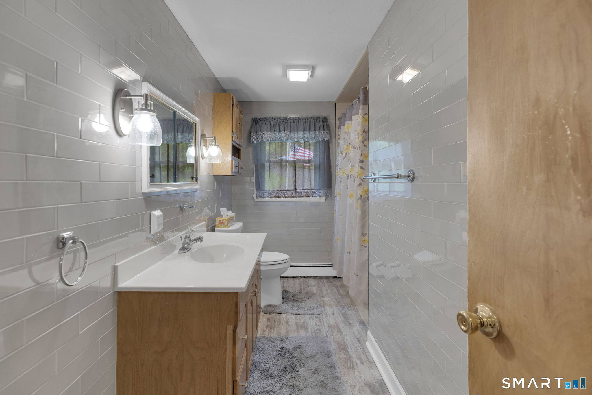 102 Wayne Lane Meriden, CT 06450 - Photo 12 of 36 a bathroom with a sink mirror and shower