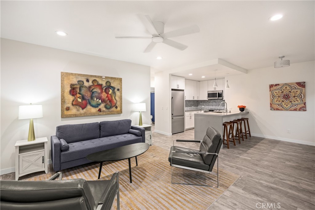 435 East Chuckwalla Road Palm Springs, CA 92262 - Photo 18 of 24 a living room with furniture and a kitchen view