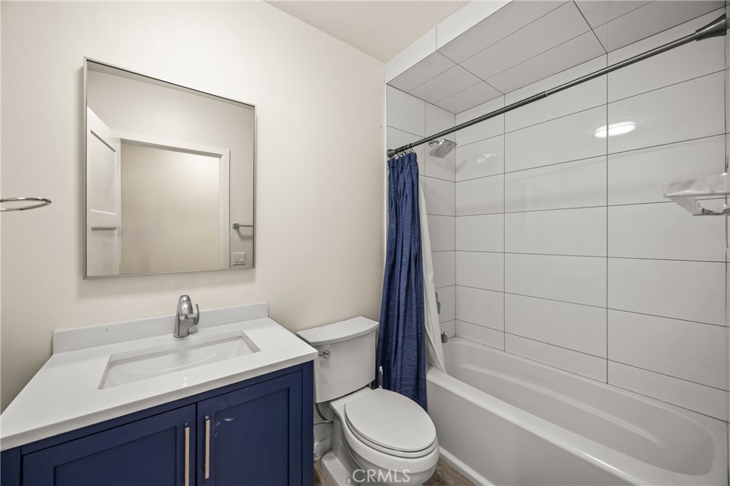 435 East Chuckwalla Road Palm Springs, CA 92262 - Photo 23 of 24 a bathroom with a granite countertop sink a toilet and shower