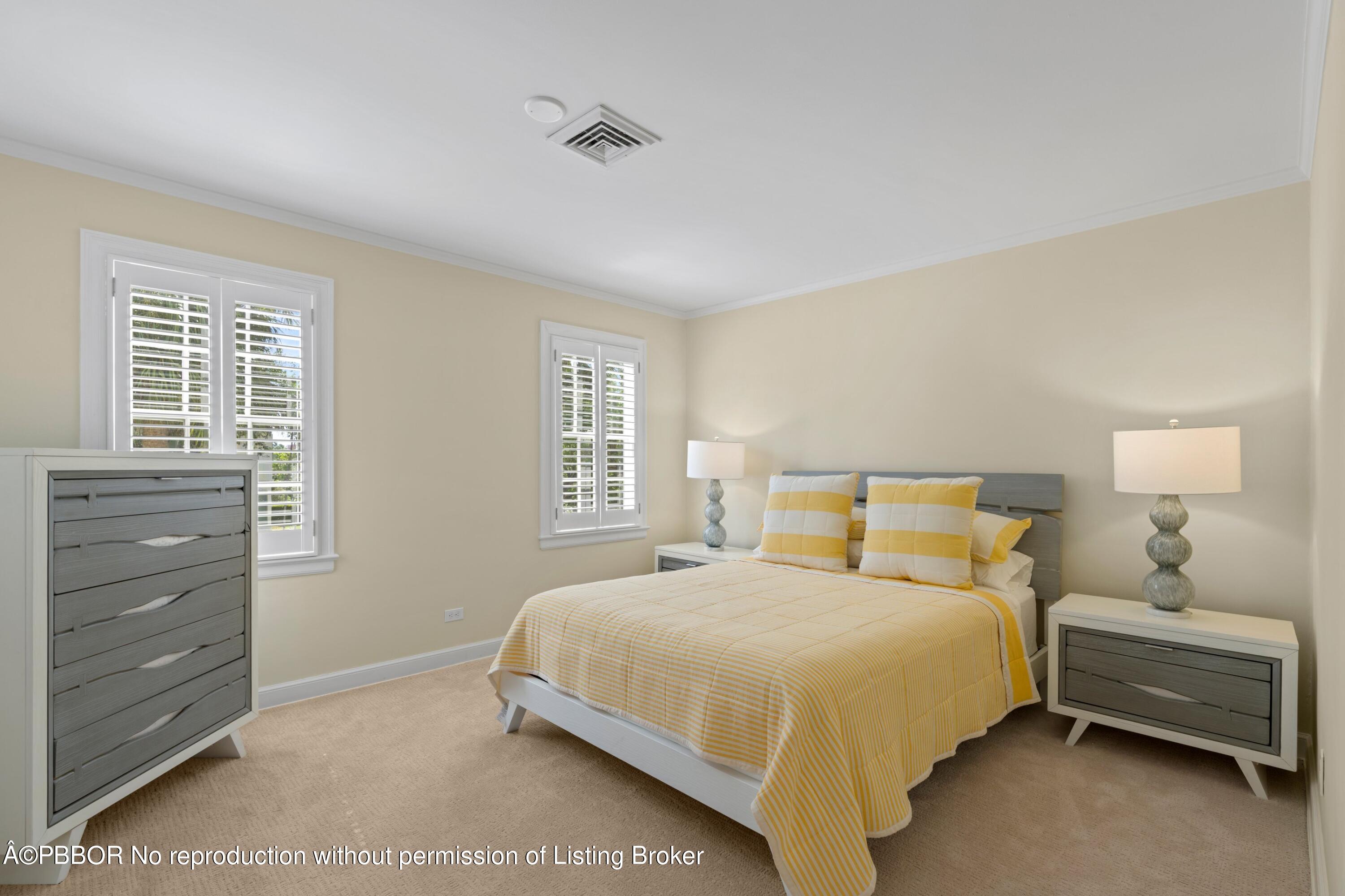 323 Arabian Road Palm Beach, FL 33480 - Photo 15 of 21 a bedroom with a bed and a window