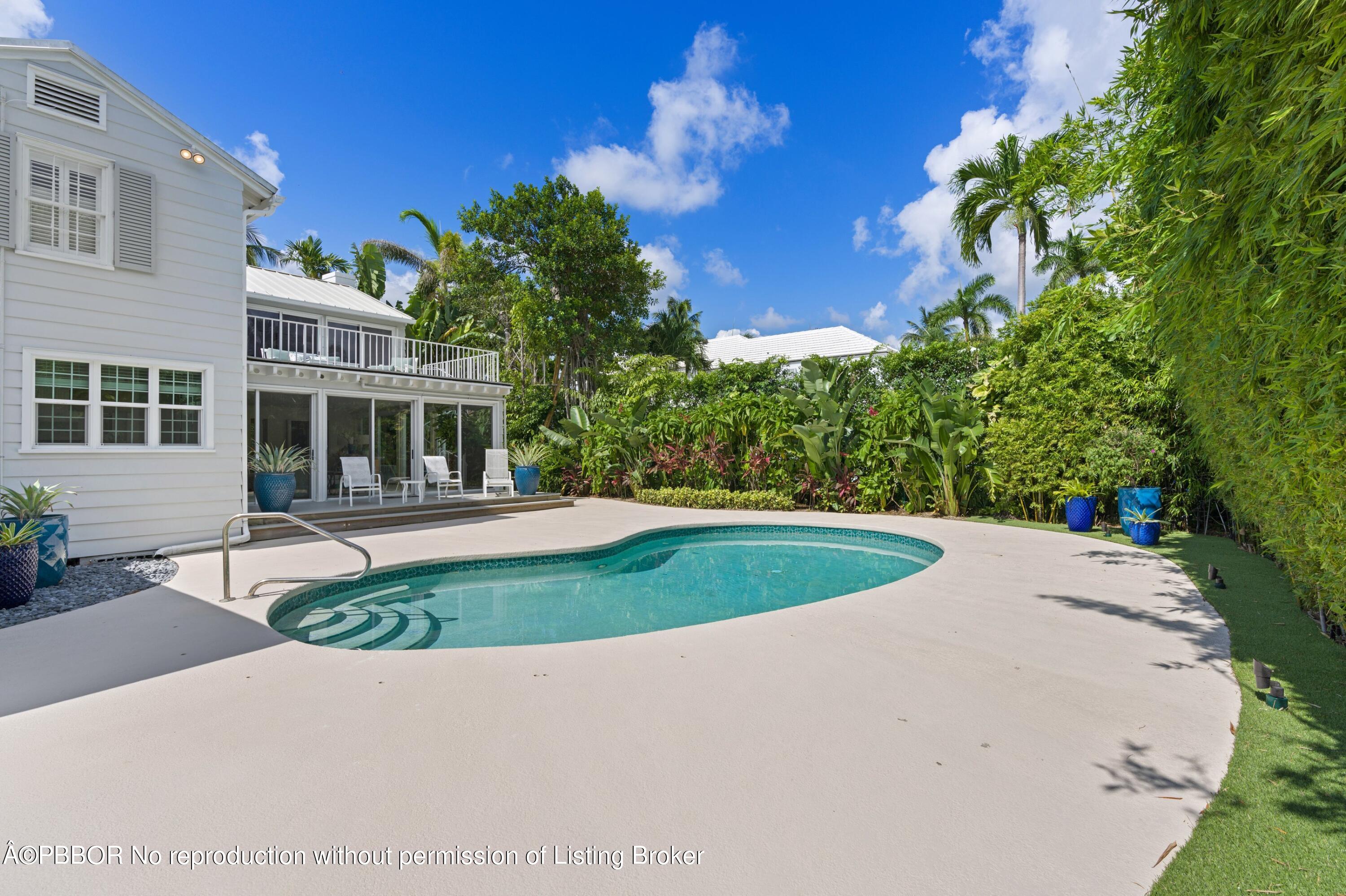 323 Arabian Road Palm Beach, FL 33480 - Photo 17 of 21 a front view of a house with a yard