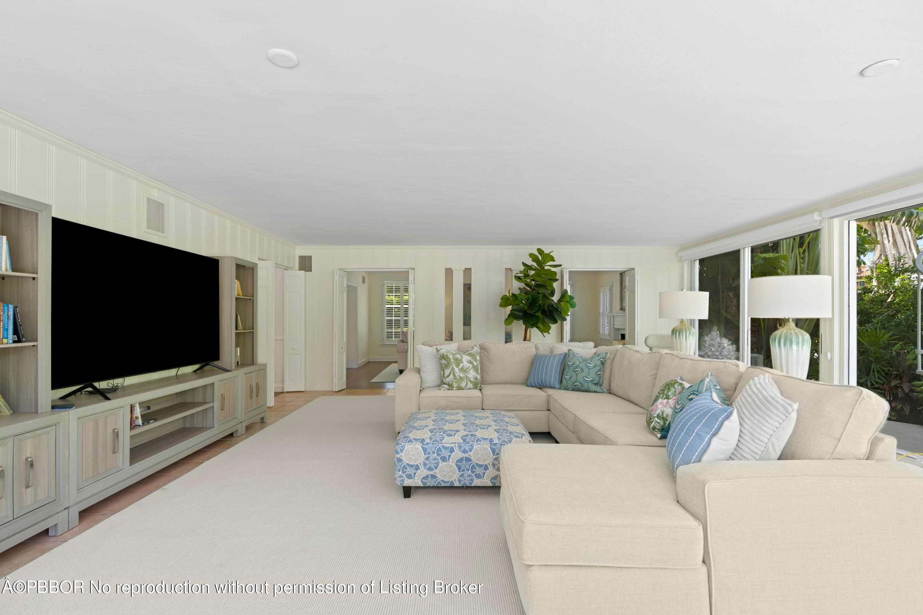 323 Arabian Road Palm Beach, FL 33480 - Photo 5 of 21 a living room with furniture and a flat screen tv