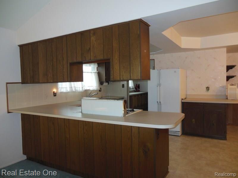 1968 Roxbury Run Wixom, MI 48393 - Photo 22 of 48 From family room view of the kitchen.