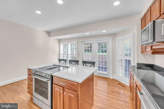 a kitchen with a table and chairs in it