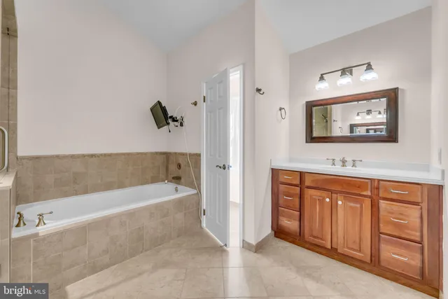 a bathroom with a sink a toilet and vanity