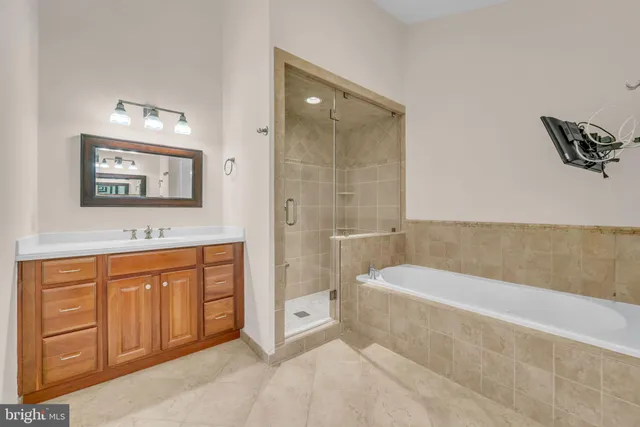 a bathroom with a bathtub and a shower