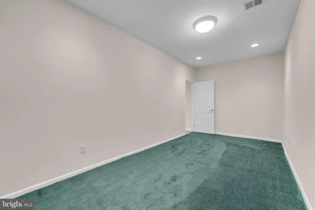 a view of a brick house with many windows