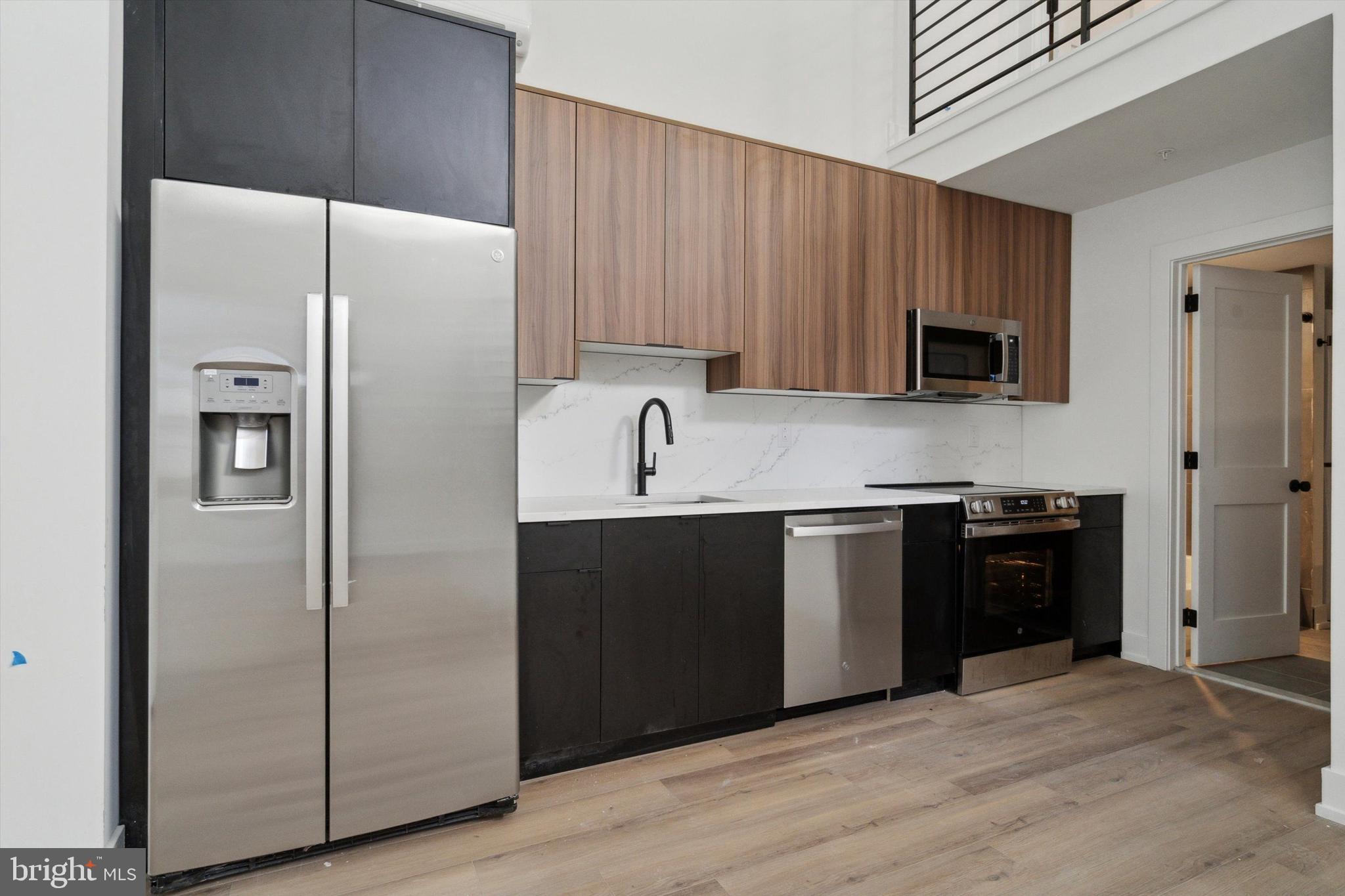 808 North 3rd Street, Unit 26 Philadelphia, PA 19123 - Photo 1 of 7 a kitchen with a refrigerator stove and sink