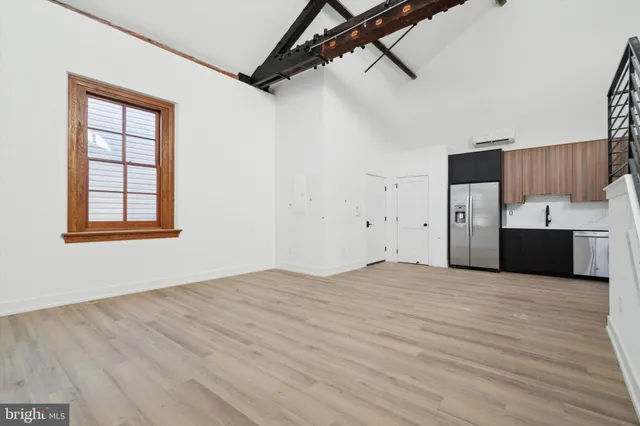a view of a kitchen with a sink and cabinets