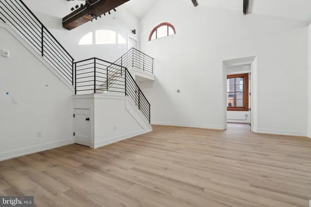 a view of an entryway with wooden floor
