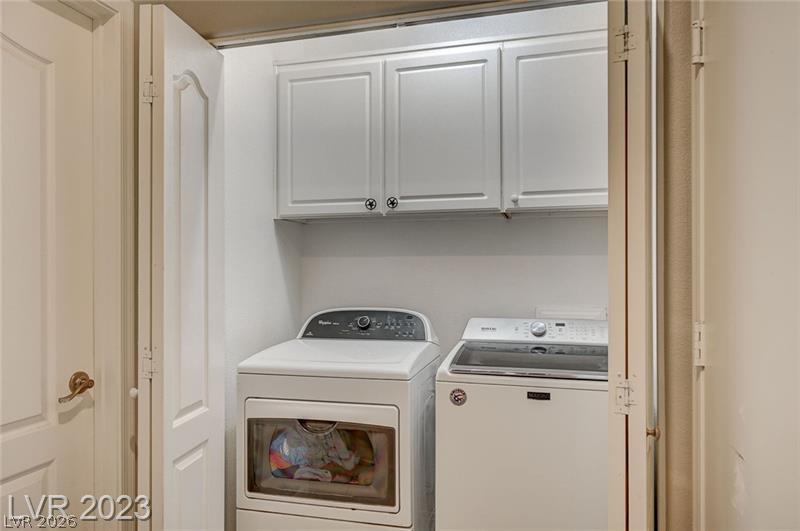 987 Cutter Street Henderson, NV 89011 - Photo 16 of 17 A well-appointed laundry closet offers efficient, convenient clothes care with included appliances.