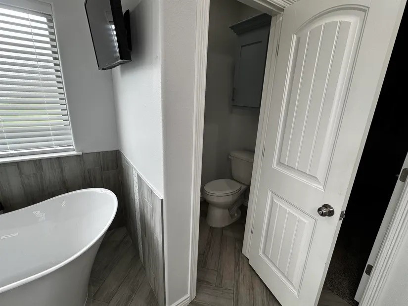 2295 Diamond D Lane Beaumont, TX 77713 - Photo 17 of 40 a bathroom with a toilet and a sink
