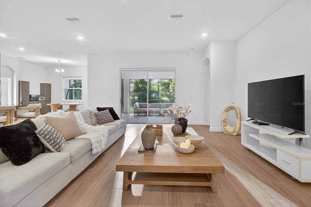 1237 Kelsa Anne Dr Spring Hill Spring Hill, FL 34609 - Photo 12 of 94 a living room with furniture and a flat screen tv