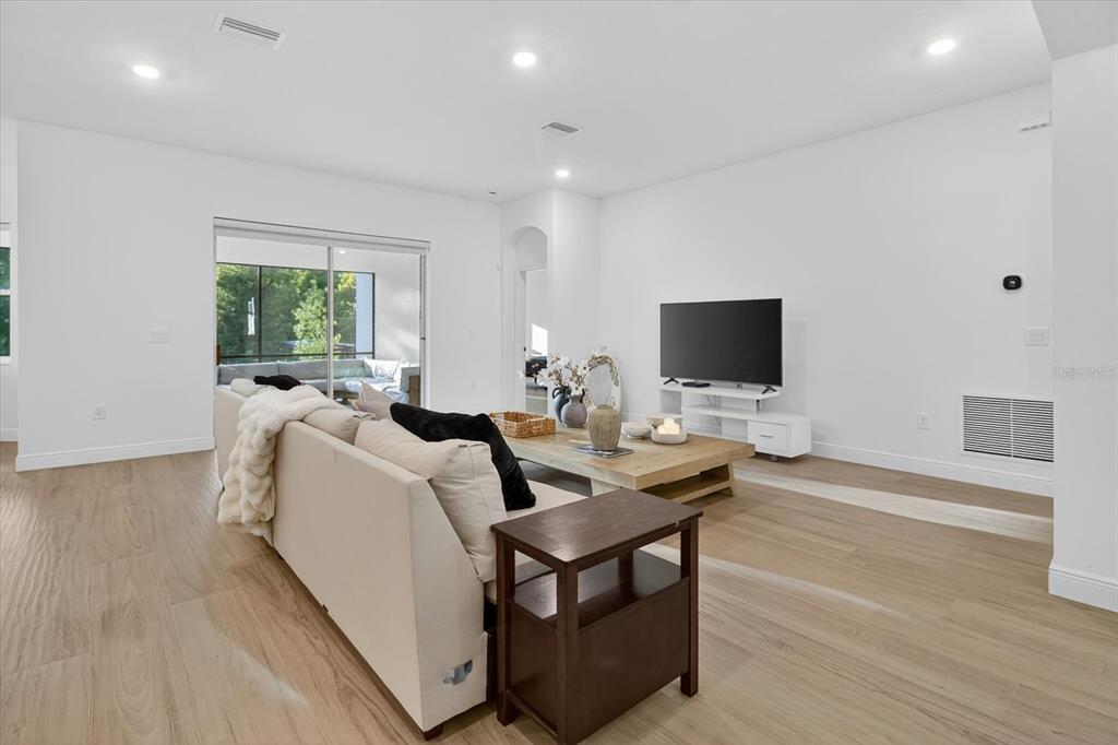 1237 Kelsa Anne Dr Spring Hill Spring Hill, FL 34609 - Photo 13 of 94 a living room with furniture and a flat screen tv