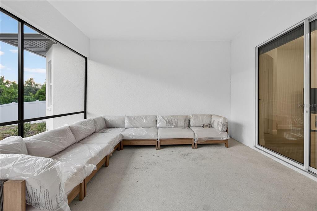 1237 Kelsa Anne Dr Spring Hill Spring Hill, FL 34609 - Photo 67 of 94 a living room with furniture and a window