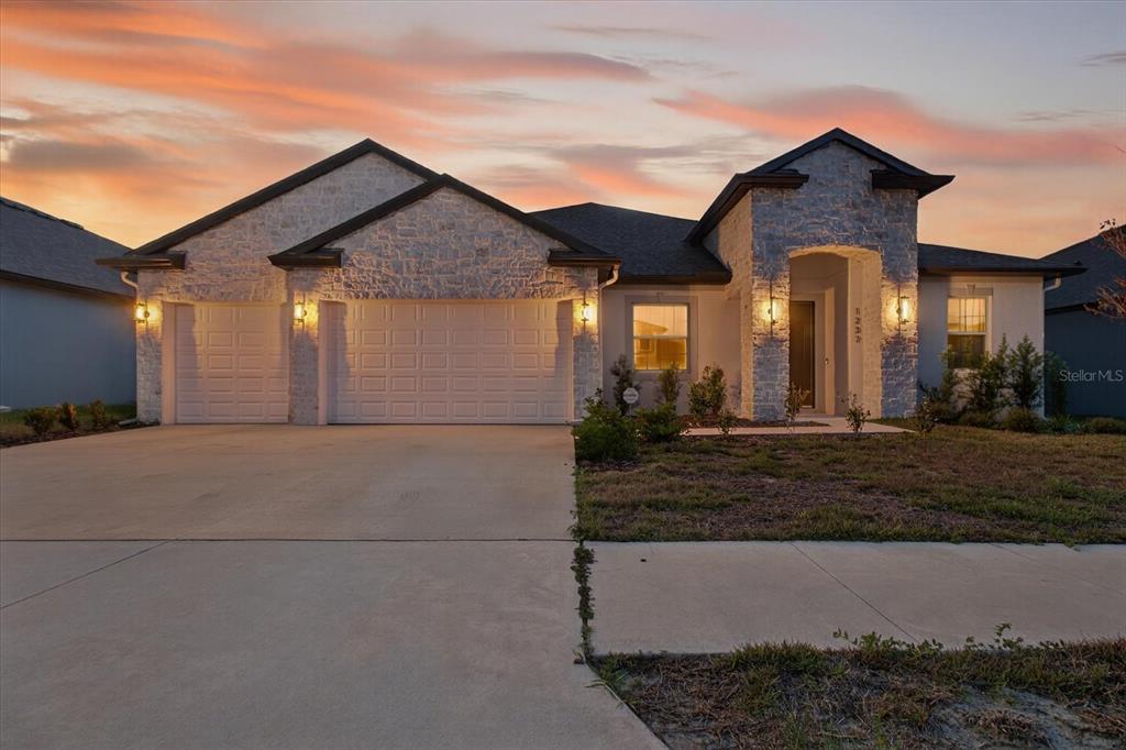 1237 Kelsa Anne Dr Spring Hill Spring Hill, FL 34609 - Photo 70 of 94 a front view of a house with garden