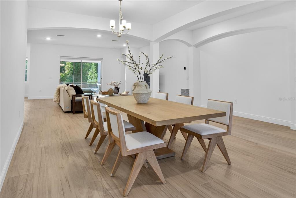 1237 Kelsa Anne Dr Spring Hill Spring Hill, FL 34609 - Photo 7 of 94 a view of a dining room with furniture window and wooden floor