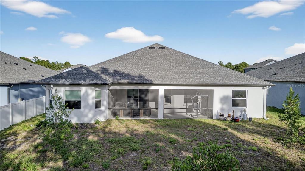 1237 Kelsa Anne Dr Spring Hill Spring Hill, FL 34609 - Photo 81 of 94 a view of a house with backyard and porch