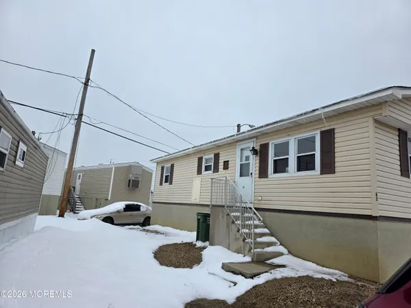 a front view of a house with chairs