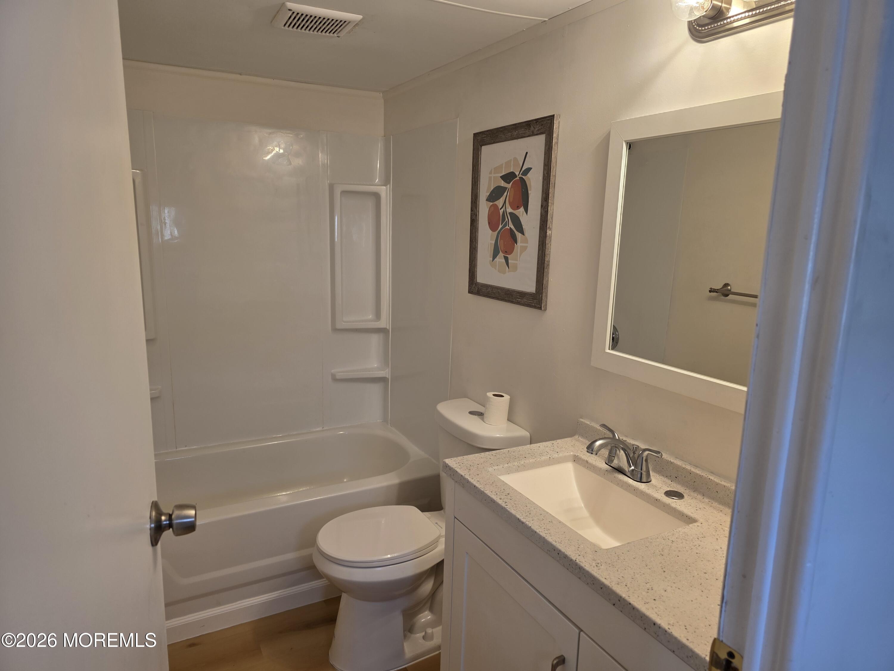 469 South Green Street, Unit 63 Tuckerton, NJ 08087 - Photo 11 of 11 a bathroom with a sink toilet and shower