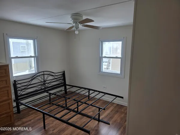 a view of an entryway with wooden floor