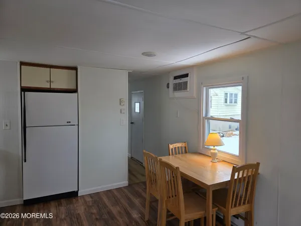 a view of a dining area with furniture and wooden floor