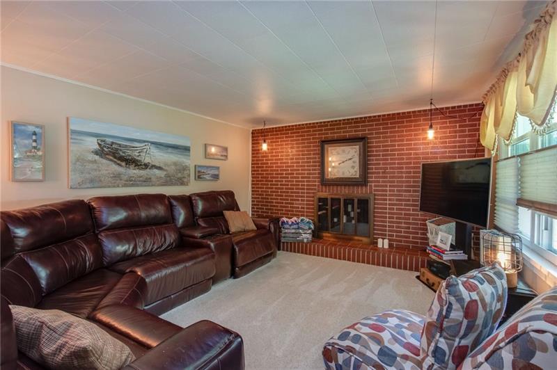 358 Holt Road Aliquippa, PA 15001 - Photo 9 of 20 Living room with brick fireplace